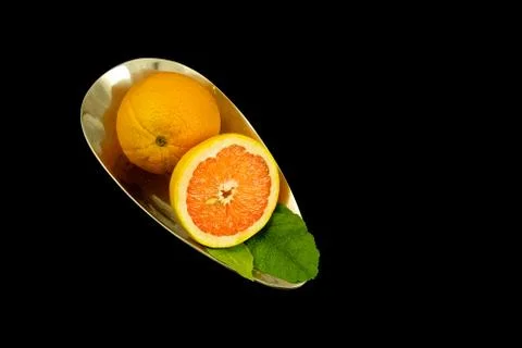 Oranges in a silver bowl Stock Photos