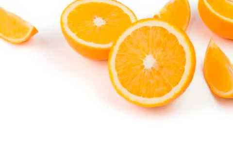 Oranges, sliced ??in half on a white background. The top view has space for t Stock Photos