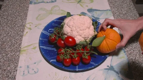 Oranges in a vegetables plate - Top View Stock Footage 124634633