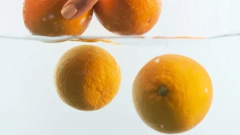 Oranges in the water. Lots of oranges. Stock Footage 142314866