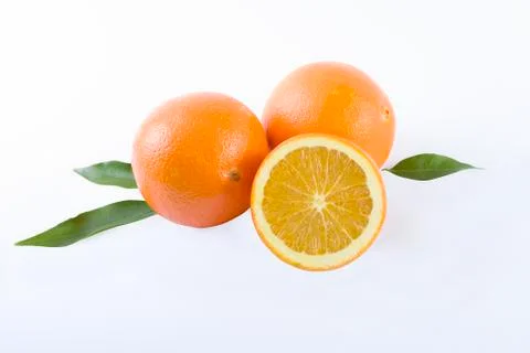 Oranges on a white background. Fresh citrus fruits on a white background. Stock Photos