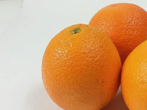 Oranges on a white background. Stock Photos