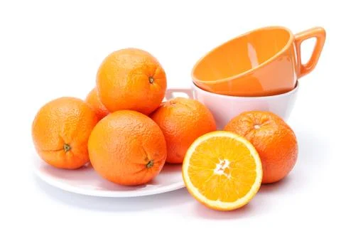 Oranges on white plate Stock Photos