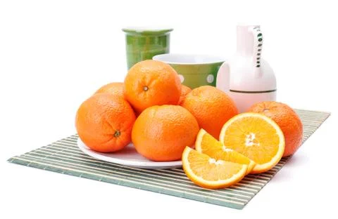 Oranges on white plate Stock Photos