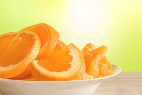 Oranges on a white plate Stock Photos