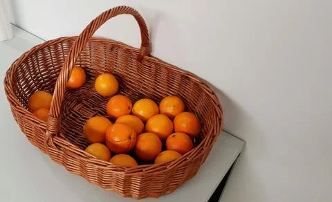 Oranges in a wicker basket Stock Photos