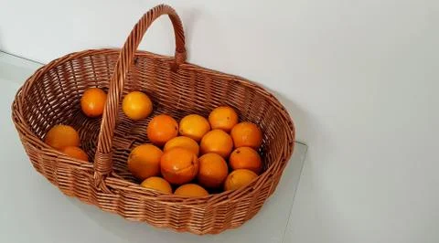 Oranges in a wicker basket Stock Photos