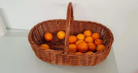 Oranges in a wicker basket Stock Photos