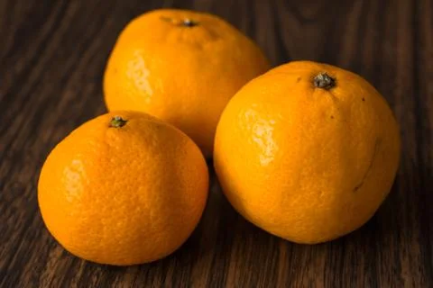 Oranges on wooden background Stock Photos