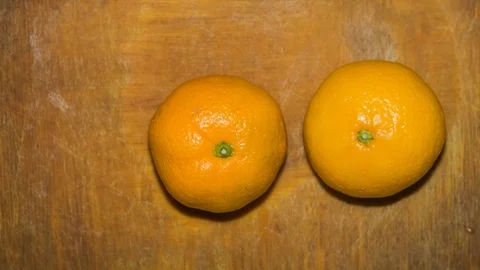 Oranges on Wooden Cutting Board Stock-Footage 85457779