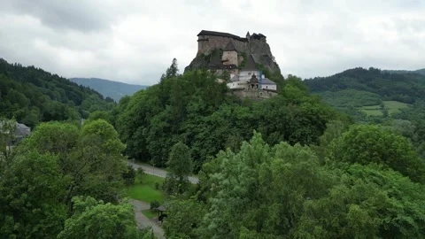 Orava Castle emerging from behind a tree. Stock Footage 244638761