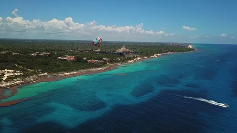 Orbit Aerial of Parasailing Canopy Wing Connected to Speedboat in Vídeos de archivo 112720115