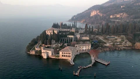 Orbit Aerial views over Punta San Vigilio - bay of the sirens in Garda Lake Stock Footage 263573271