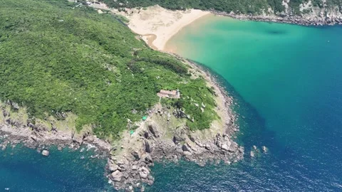 Orbit around Bai Mon Beach and Mui Dien Lighthouse resembling Vietnam's map Stock Footage 339406846