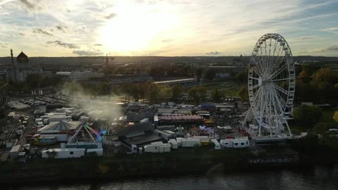 Orbit around fairground ferris wheel beside Dresden Old Town Video stock 331216613