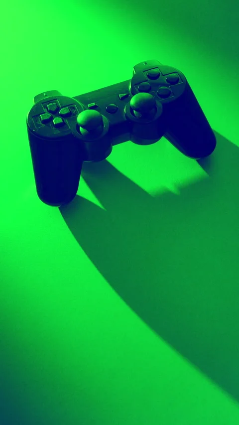 Orbit Around Game Controller edited in Green and Violet Colours and Long Shadows 動画素材 346696151
