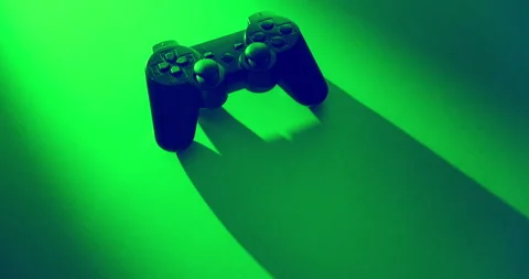 Orbit Around Game Controller edited in Green and Violet Colors and Long Shadows 動画素材 346696205