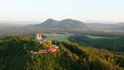 Orbit Around Medium Sized Medieval Castle Smlednik, In the Sunset. Video stock 237601785