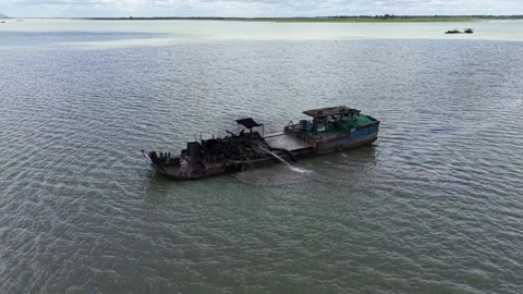 Orbit around a sand dredging rig with Ba Den Mountain appearing beyond Stock Footage 344906384