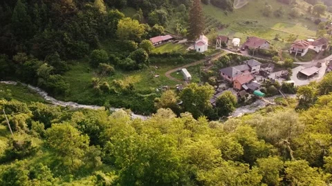 Orbit circle view of a church on a top of hill with stream and forest. Stara Stock Footage 137006806