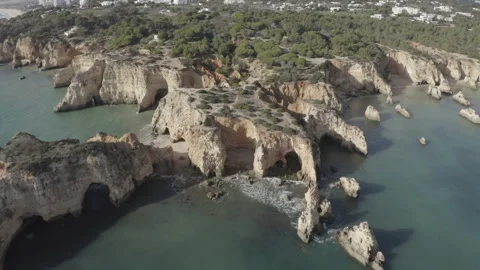 Orbit Down Aerial Of Cliffs By The Sea At Algarve Portimao 4K Stock Footage 167244073