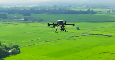 Orbit drone shot capturing modern mapping and engineering drone hovering over Stock Footage 337392992