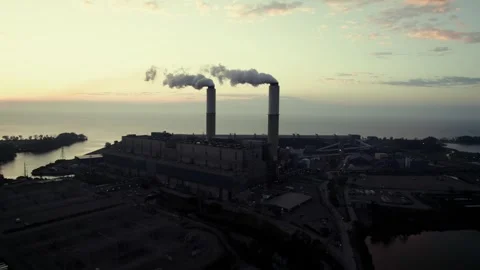 Orbit drone shot of Monroe Power Plant at sunrise with Lake Erie in Monroe 動画素材 302715270