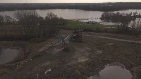 Orbit drone shot of old miner near highway and railway infrastructure Stock Footage 330189895
