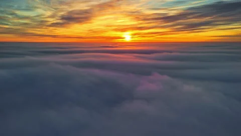 Orbit drone shot of skyscape with clouds at sunset Stock Footage 303871882