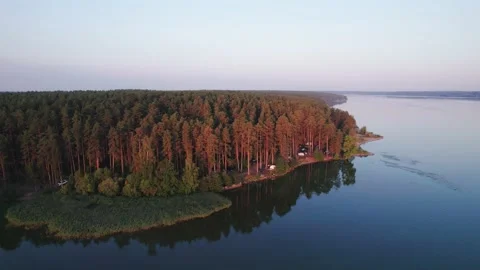 Orbit flight around camping site on river bank Stock Footage 213070745