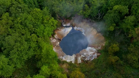 Orbit footage of a geothermal pond deep in forest Hokkaido,Japan Stock Footage 288580324