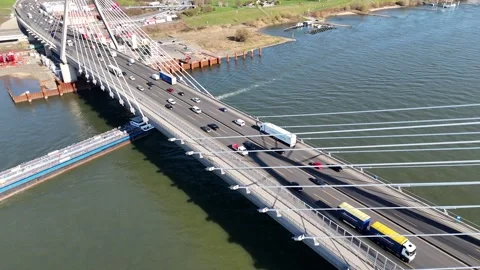 Orbit move around bridge tower revealing traffic below Stock Footage 331201081