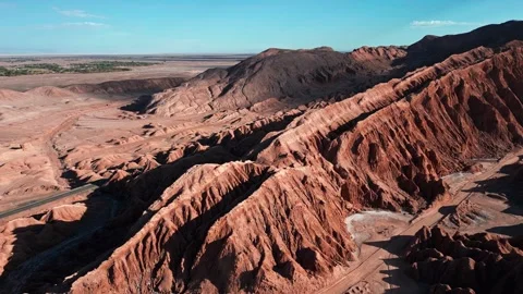 Orbit over dramatic eroded salt rock ridges and ravines of the Cordillera de la Stock Footage 336266202