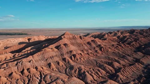 Orbit over dramatic eroded salt rock ridges and sharp peaks revealing vast arid Stock Footage 336266443