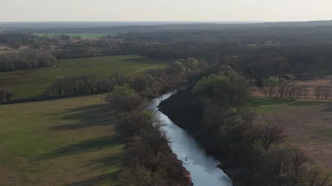 Orbit of River Stretching Through Rural Oklahoma at Sunset Stock Footage 331957769