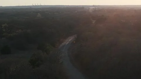 Orbit of Rural Road Winding Through Trees in Oklahoma at Sunset Stock Footage 331957583