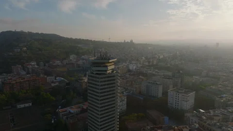 Orbit shot around Edifici Colon. High rise office building towering above Stock-Footage 246009169