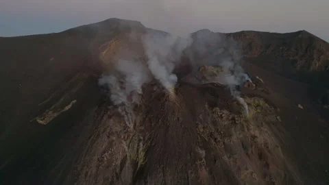 Orbit shot of Stromboli volcano at sunset, Sicily - 4K 60 FPS Aerial drone Stock Footage 201882966