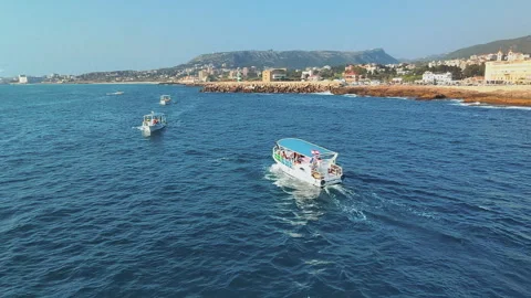 Orbit Shot Of Two Ferry Boats Sailing Near Each Other In Blue Sea, Batroun Stockbeeldmateriaal 331672299