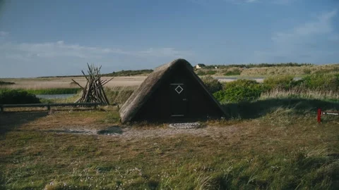 Orbit Sod Hut or Dwelling Houses in European Sand Dunes Nature Video stock 252193378
