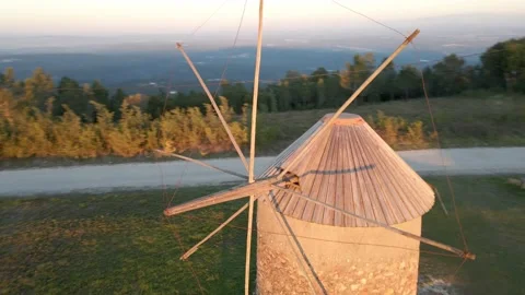 Orbit view of a windmill on the top of the mountain Stock Footage 220379072