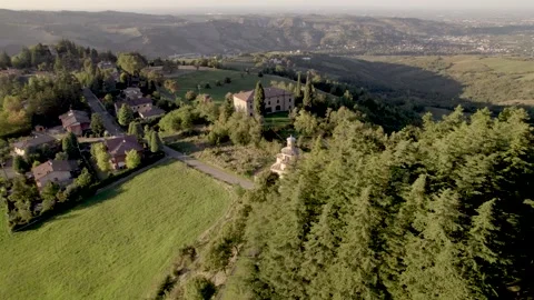 Orbita 4k drone view above ancient church on top of a hill in Emilia Romagna Stock Footage 297353255
