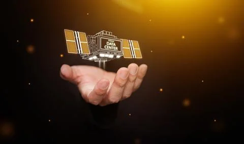 Orbital data center satellite in space floating above hand and powered by s.. 库存照片