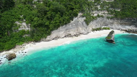 Orbital drone footage of empty Suwehan Beach on sunny day. Nusa Penida Island Stock Footage 285088010