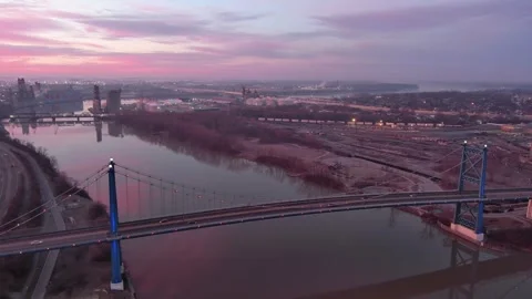 Orbital drone shot, Anthony Wayne Bridge, downtown Toledo, OH, sunrise Stock Footage 288031018