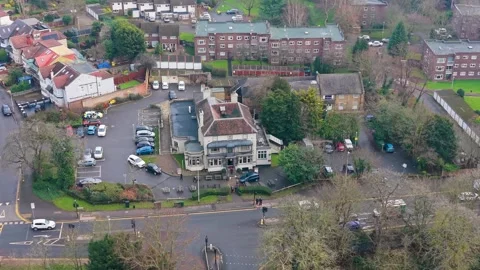 Orbital drone shot of historic Eagle pub, now Toby Carvery, Snaresbrook Stock Footage 327652221