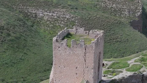 Orbital flight with a drone over the 9th century Oreja castle, creating a Stock Footage 275153370