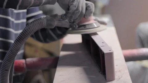 Orbital sanding machine in workers hands Stock-Footage 129023141