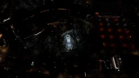 Orbital view of a circus tent with parked and circulating vehicles, in the Video stock 340418539