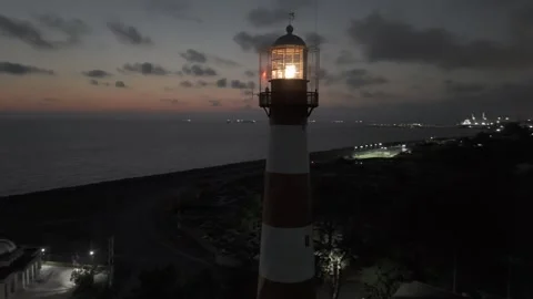 Orbital view of lighthouse captured by drone at evening, hovering around the Stock Footage 330588329